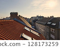 Tiled Building Roofs Over a City Street 128173259