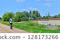 Man at bicycle, in the middle of summer nature. Concept of a healthy lifestyle. 128173266