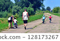 Family walking along the road on nature travel 128173267