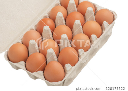 Eggs in a paper box isolated on white. Eggs in a paper box isolated on white. 128173522