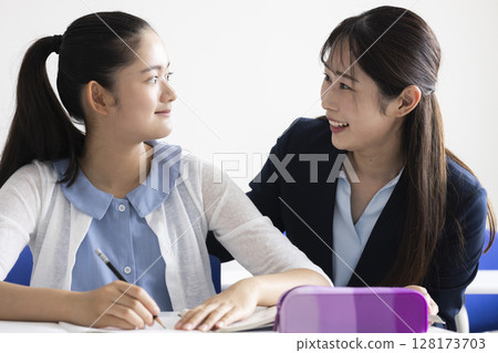 Children studying and teachers teaching Children studying and teachers teaching 128173703