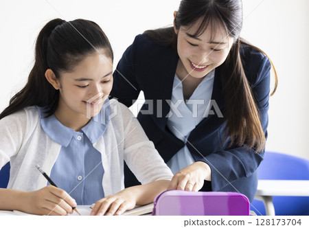 Children studying and teachers teaching Children studying and teachers teaching 128173704