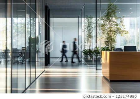 Modern Open-Concept Office with Business Professionals in Motion and Wooden Desk Space for Text Modern Open-Concept Office with Business Professionals in Motion and Wooden Desk Space for Text 128174980