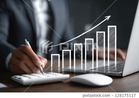 Modern Workspace with Hand Working on Projects and Graphs Showing Growth and Success 128175117