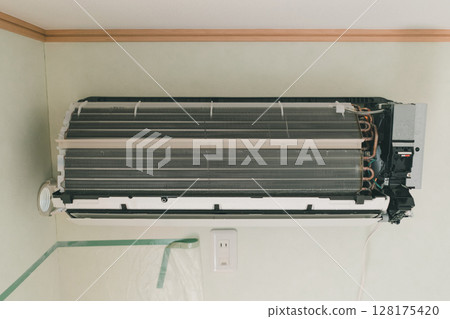 Air conditioner indoor unit with aluminum fins exposed 128175420