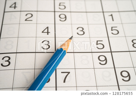 Sudoku puzzle game playing to challenge brain. Sudoku puzzle game playing to challenge brain. 128175655