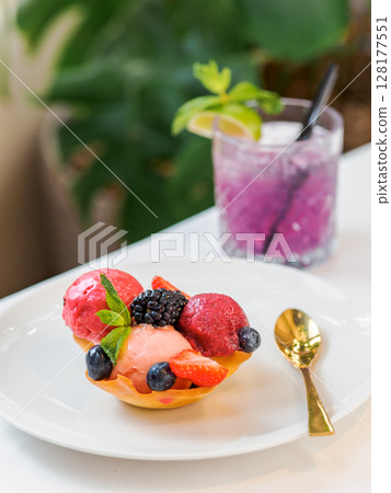 Berry sorbet with three flavors - strawberry, raspberry, black currant. Scoop ice cream sorbet decorated fresh berries and mint. Summer ice cream concept 128177551