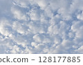 Sheep clouds in the blue sky 128177885