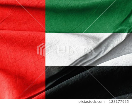 a flag of the united arab emirates waving in wind 128177925