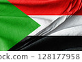 Flag of Sudan in Vibrant Colors Displayed on Textured Fabric Background 128177958