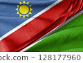 Namibia Flag Combined with Green Fabric in a Close-Up View 128177960