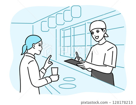 A male bar attendant taking orders at the counter A male bar attendant taking orders at the counter 128178213