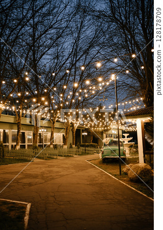 Festive Outdoor Evening with String Lights and Decor Festive Outdoor Evening with String Lights and Decor 128178709