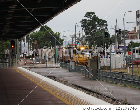 Here comes the yellow train - Townsville station, morning approach Here comes the yellow train - Townsville station, morning approach 128178740