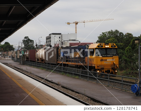 Yellow through the city - PN010 passing through Townsville station 128178741