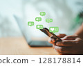Businessman using smartphone with social media icons for business communication 128178814