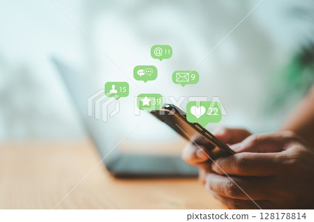 Businessman using smartphone with social media icons for business communication 128178814