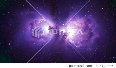A glowing purple nebula cloud in the center of space A glowing purple nebula cloud in the center of space 128178876