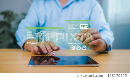 Person interacting with ESG holographic display for sustainable development and corporate responsibility 128179325