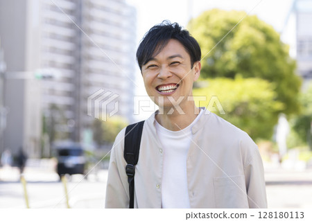 A man in his 40s smiling at the camera 128180113