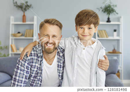 Portrait Of Happy Son And Father Celebrating Father Day At Home Portrait Of Happy Son And Father Celebrating Father Day At Home 128181498