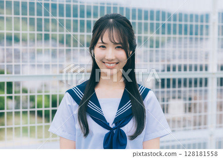 high school girl standing on the roof 128181558