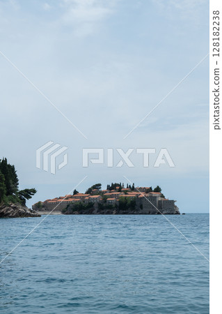 Sveti Stefan private island in Montenegro near Budva. Adriatic Sea Coast travel destination vacation holiday idea. Concept of getting away tourism experiences. Nature driven scenery Sveti Stefan private island in Montenegro near Budva. Adriatic Sea Coast travel destination vacation holiday idea. Concept of getting away tourism experiences. Nature driven scenery 128182238