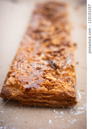 Crunchy Caramelized Puff Pastry with Nuts Sweet Dessert Close-Up 128183267