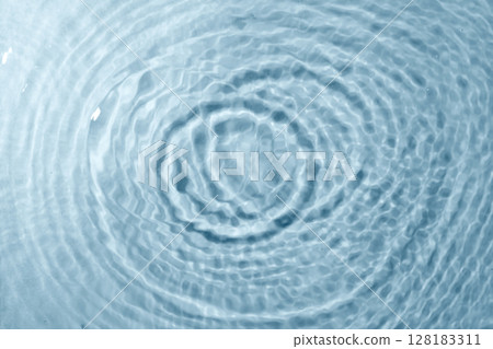 Blue water texture background. Clean transparent water surface with rings and ripples. Summer concept. Flat lay Blue water texture background. Clean transparent water surface with rings and ripples. Summer concept. Flat lay 128183311