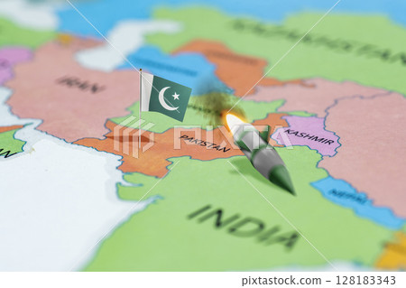 Pakistan flag on the world map launches nuclear missiles at India. Pakistan vs India military war conflict. Weapon of a nuclear missile battle Pakistan flag on the world map launches nuclear missiles at India. Pakistan vs India military war conflict. Weapon of a nuclear missile battle 128183343
