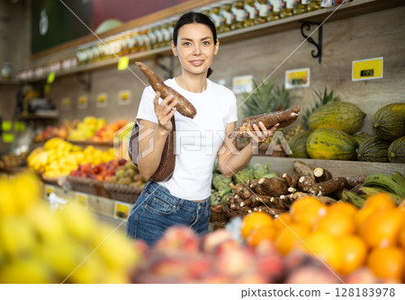 Woman choosing tapioca in a supermarket Woman choosing tapioca in a supermarket 128183978