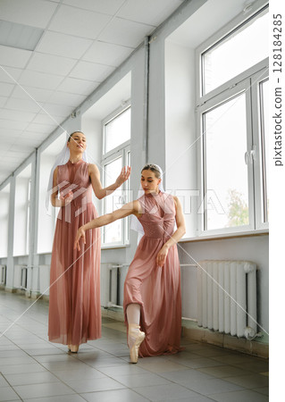 Ballerinas in the corridor repeat movements, hone their skills Ballerinas in the corridor repeat movements, hone their skills 128184285
