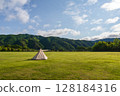 Solo camping in a large campsite on a sunny day 128184316