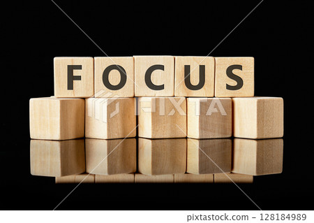 The concept word FOCUS is assembled from cubes. Search for words and information concept The concept word FOCUS is assembled from cubes. Search for words and information concept 128184989