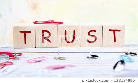 The concept word TRUST is assembled from wooden cubes. Investment based on trust concept The concept word TRUST is assembled from wooden cubes. Investment based on trust concept 128184990