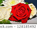 One Fresh red roses in a bouquet 128185492