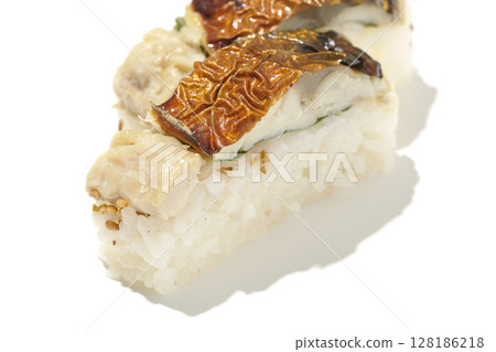 Grilled mackerel sushi photographed on white background Grilled mackerel sushi photographed on white background 128186218