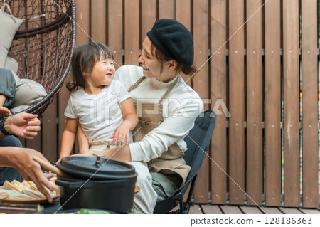 Parents, daughters, and children enjoying camping, glamping, vacation homes, and private lodgings 128186363