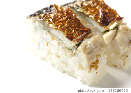 Grilled mackerel sushi photographed on white background Grilled mackerel sushi photographed on white background 128186423