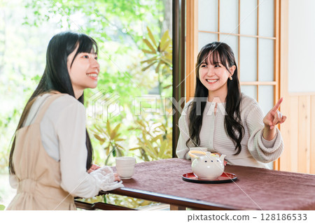Young Asian woman on a girls trip to a ryokan or hot spring inn (travel, Japanese-style room, veranda) Young Asian woman on a girls trip to a ryokan or hot spring inn (travel, Japanese-style room, veranda) 128186533