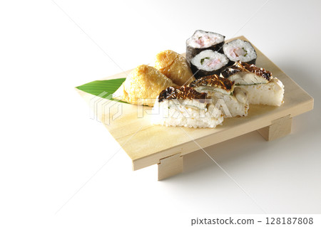 Grilled mackerel, norimaki, and inari sushi photographed on a white background 128187808
