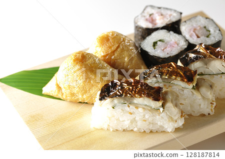 Grilled mackerel, norimaki, and inari sushi photographed on a white background 128187814