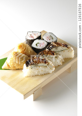 Grilled mackerel, norimaki, and inari sushi photographed on a white background 128187816