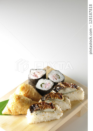 Grilled mackerel, norimaki, and inari sushi photographed on a white background Grilled mackerel, norimaki, and inari sushi photographed on a white background 128187818