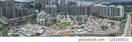July 1 2025 Modern Urban Neighborhood with Green Space and High-Rise Buildings 128188021