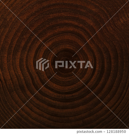 A square background image of a board with fine grained dark brown wood grain showing annual rings 128188950