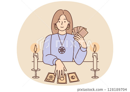 Woman with Tarot cards in form of witch sits at table and predicts future being fortune teller 128189704