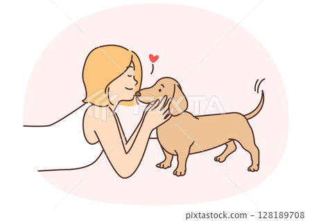 Cute girl kissing puppy enjoying communication with beloved pet and caring for dachshund Cute girl kissing puppy enjoying communication with beloved pet and caring for dachshund 128189708