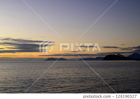 A peaceful morning at the Coral Sea in Far North Queensland, Australia, where soft light, gentle waves, and tropical serenity create a tranquil coastal scene full of natural beauty and calm. 128190327