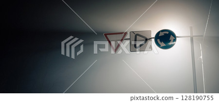 Road Signs in Fog at Night - Minimal Urban Composition Road Signs in Fog at Night - Minimal Urban Composition 128190755